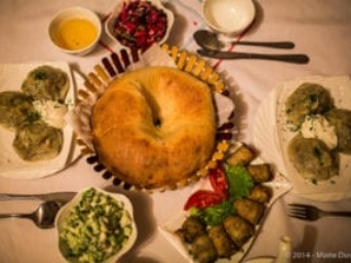 Samarkand, dinner time with bread, salad and manti (dumpling)
